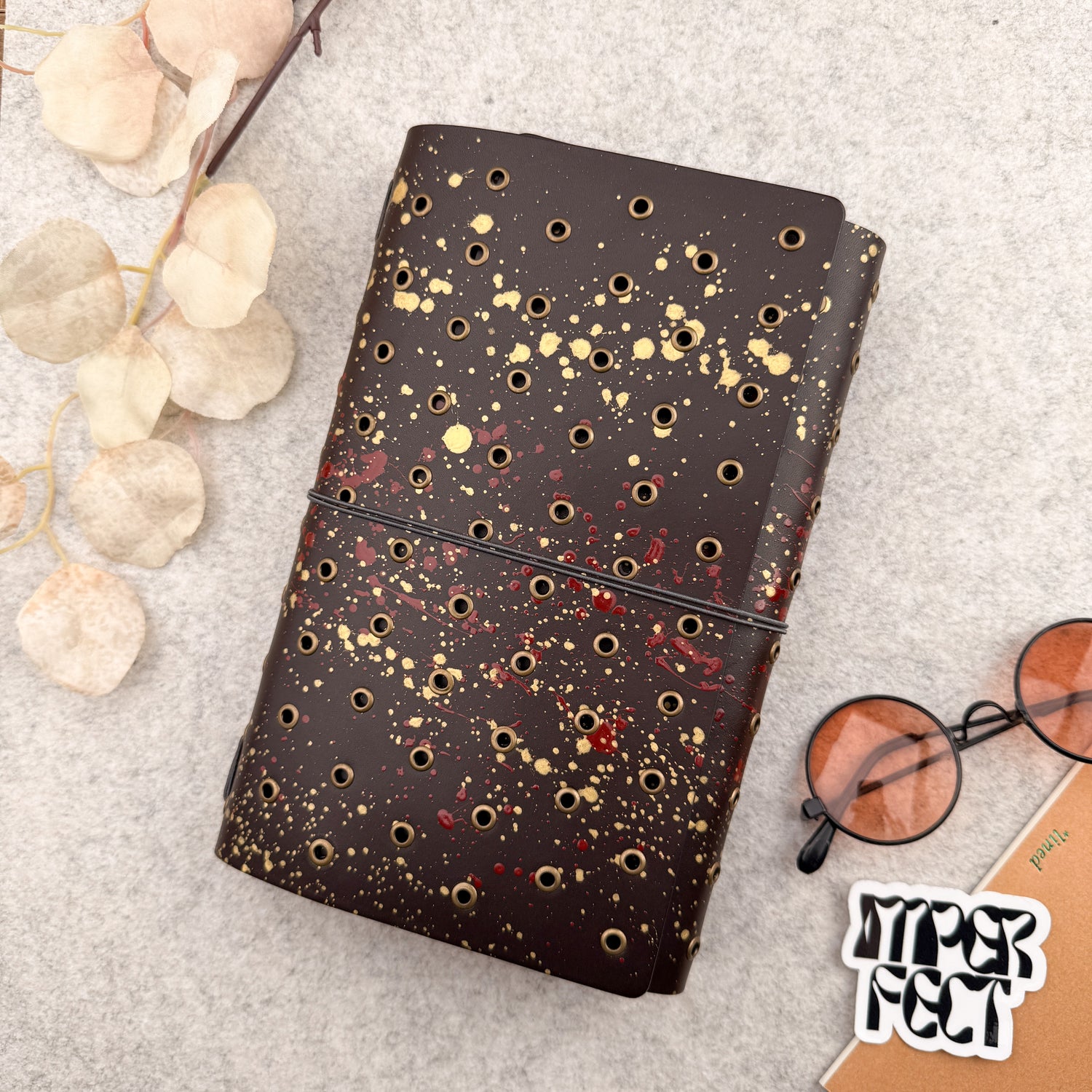 Imperfect Concepts Dancer Leather Notebook - A5 Trifold - Painted Dark Brown w/ Brass Grommets