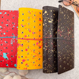 Imperfect Concepts Dancer Leather Notebook - A5 Trifold - Painted Dark Brown w/ Brass Grommets