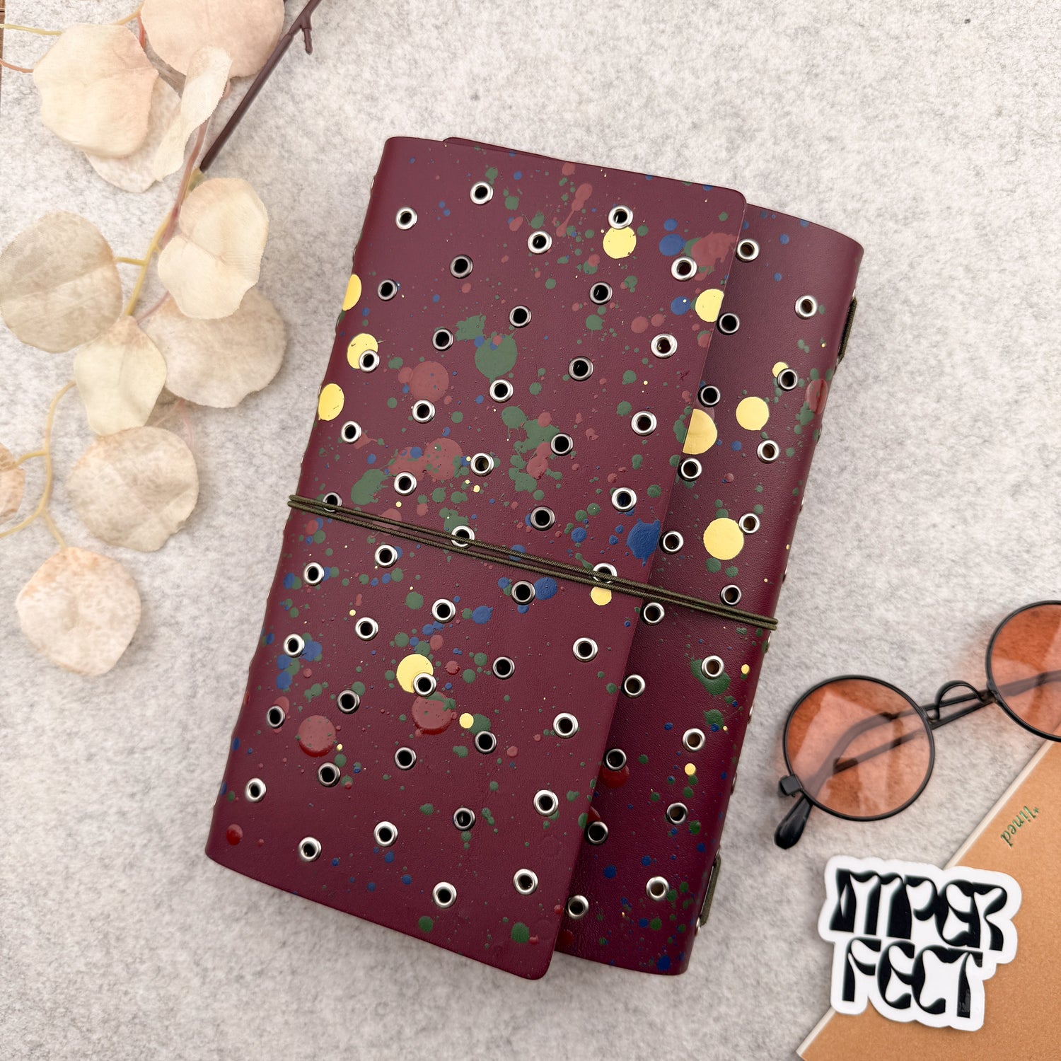 Imperfect Concepts Dancer Leather Notebook - A5 Trifold - Painted Maroon w/ Gunmetal & Silver Grommets