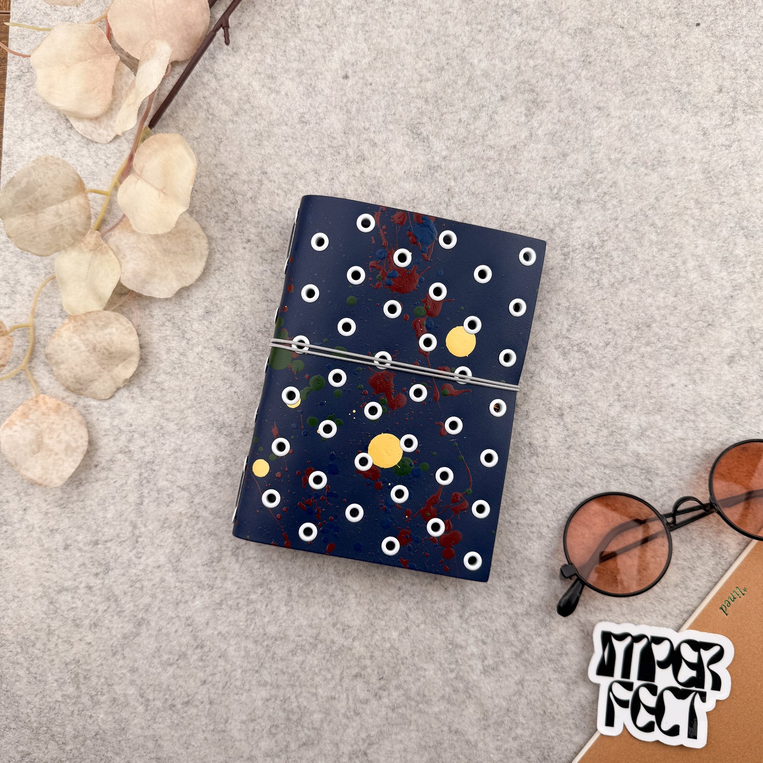Imperfect Concepts Max Leather Notebook - A6 Bifold - Painted Blue w/ White Grommets