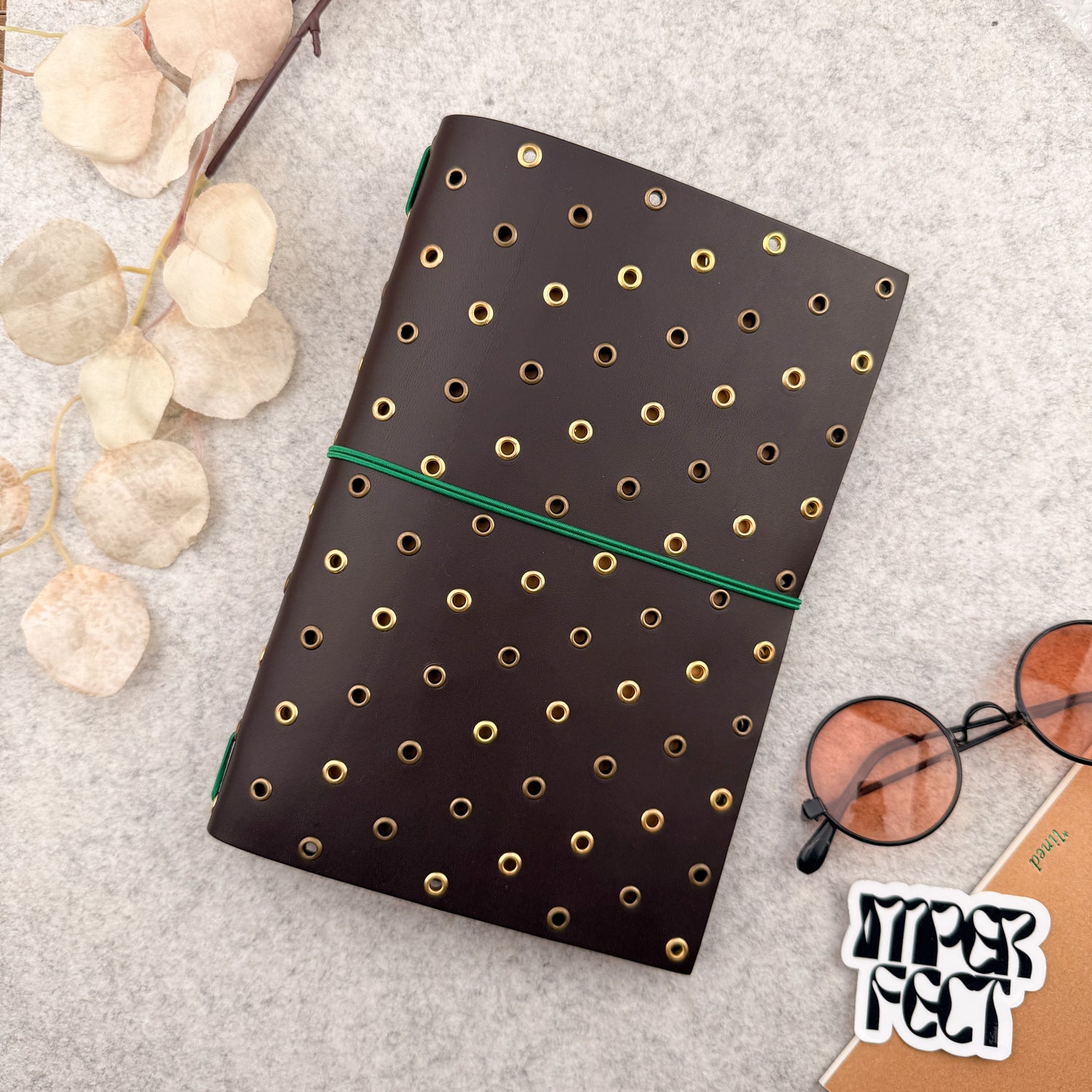 Imperfect Concepts Thatcher Leather Notebook - A5 Bifold - Dark Brown w/ Gold & Bronze Grommets