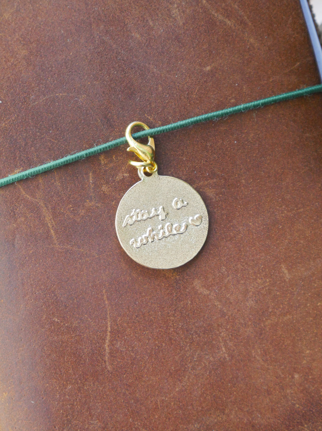 dana ate oatmeal! "stay a while" brass charm
